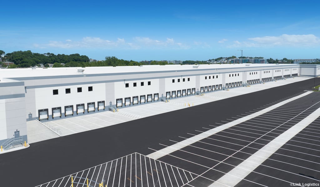 oblique aerial of Trident Logistics Center trailer drops and adjacent parking field on a sunny day with blue skies.