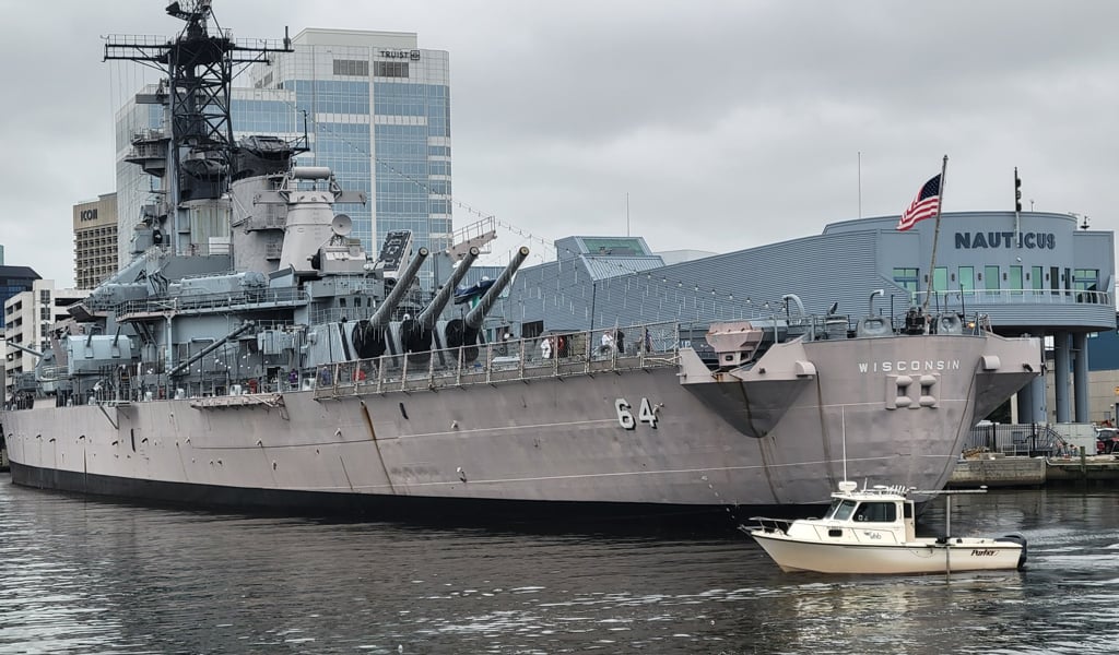 Another angle of VHB’s boat floating beside the massive USS Wisconsin retired battleship.