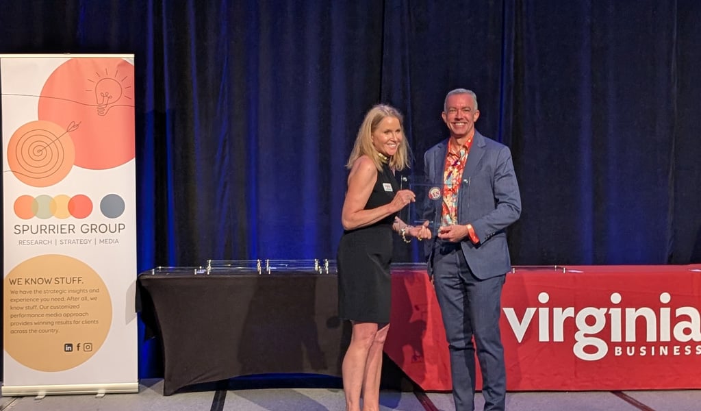 Joe Wanat accepts VHB’s Best Places to Work Award on stage. 