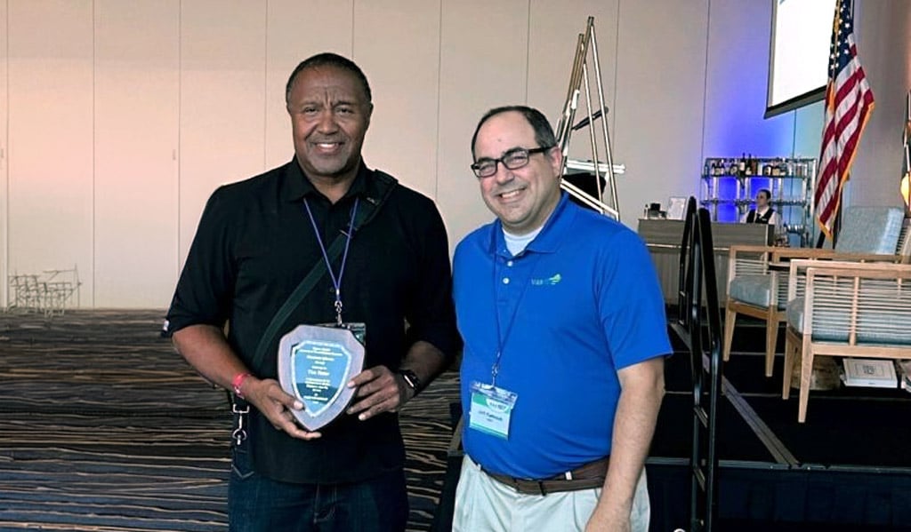 Tim Foster stands with VASITE President, Jeff Kuttesch, to pose with award.