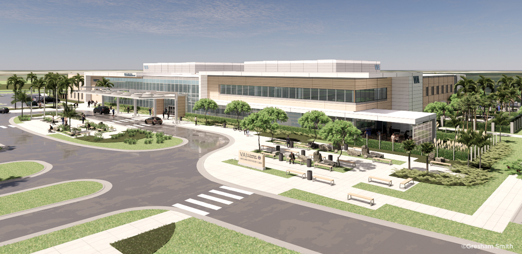 A color rendering of a modern two-story healthcare clinic with people entering and exiting by a flagpole and crosswalk