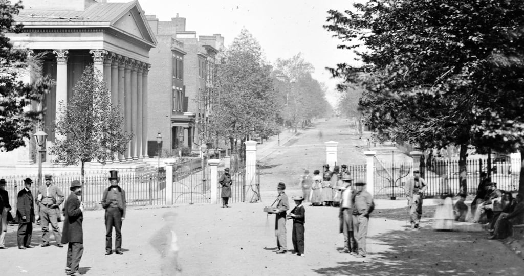 1865 historic photograph that shows the fence and gate details that the newly constructed one was modeled after. 