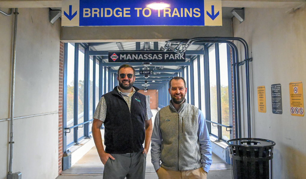 Two VHBers smile at the camera at the ribbon cutting ceremony.