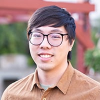 A person wearing a brown shirt.