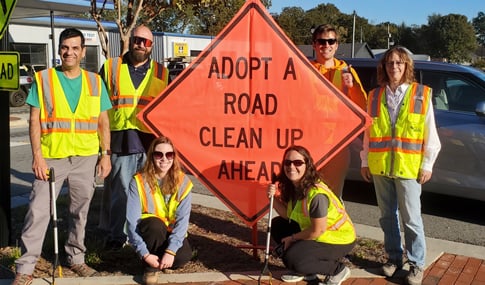 VHB team members outside during an adopt-a-road clean up event.