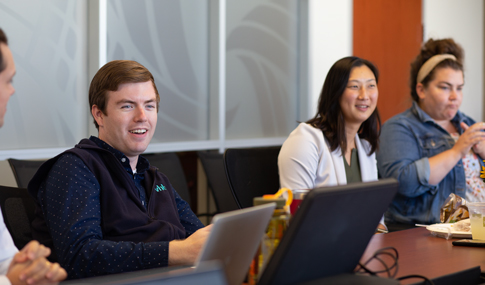 VHB emerging professionals sit around a conference table