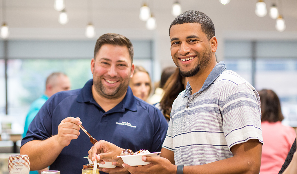 Two VHB employees enjoy a treat during an ice cream social.