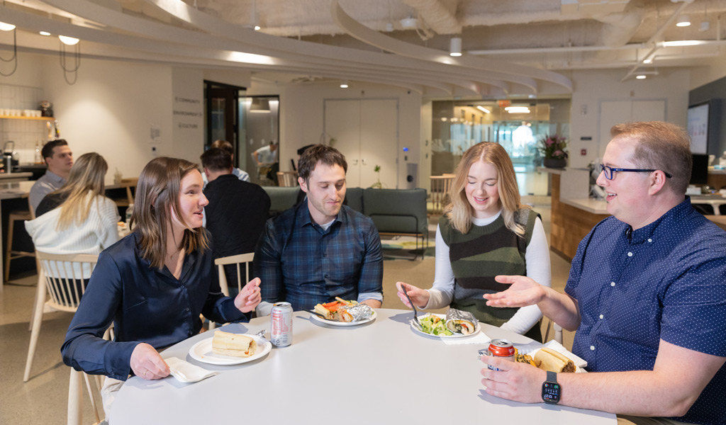 Group of EPG members having a lunch discussion around a conference table.
