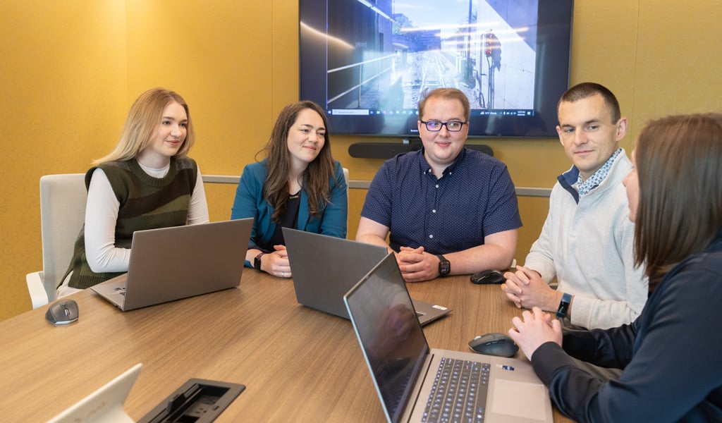 VHB team members collaborating during a project review session in a conference room.