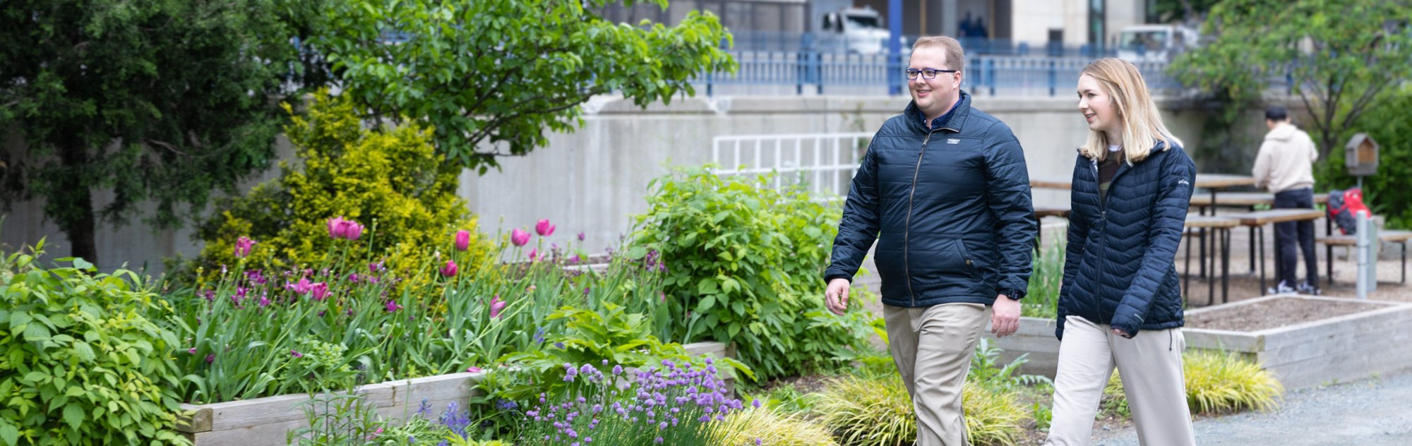 Gavin Graham and a teammate walking through downtown Boston during a collaborative discussion.