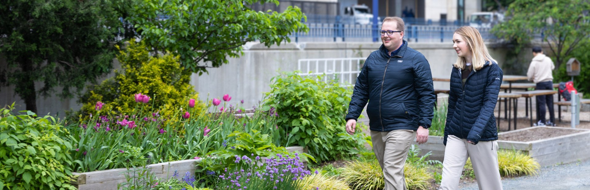 Gavin Graham and a teammate walking through downtown Boston during a collaborative discussion.