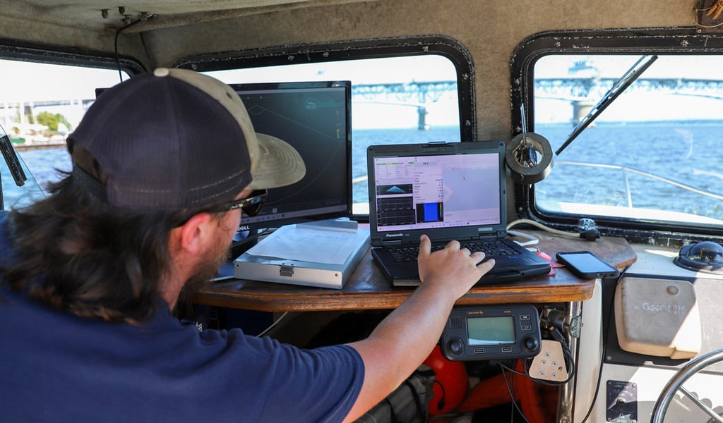 Mike Conklin monitoring the data, watching the sonar readouts.