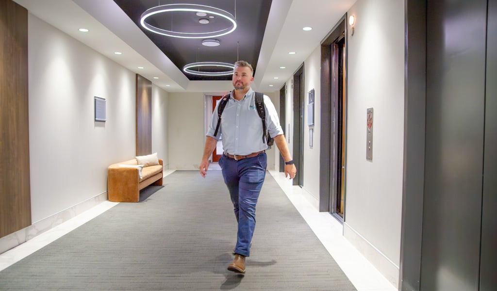 J.R. Hopson walking through the corridor toward VHB’s Charlotte office in the morning. 