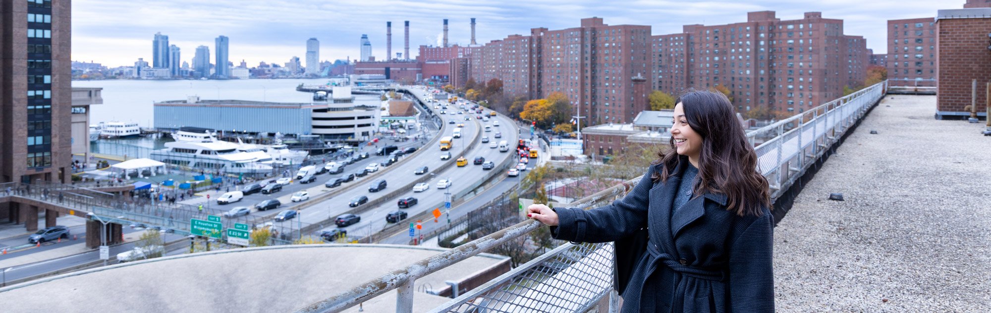 Lindsey Cassone on the roof of the CUNY Hunter College Brookdale campus overlooking the New York City skyline.