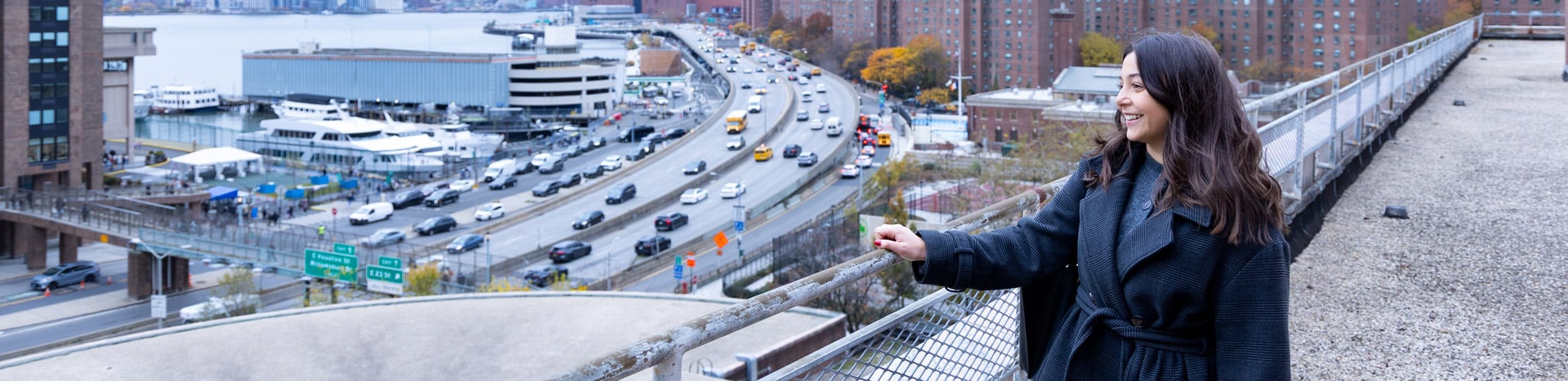 Lindsey Cassone on the roof of the CUNY Hunter College Brookdale campus overlooking the New York City skyline.