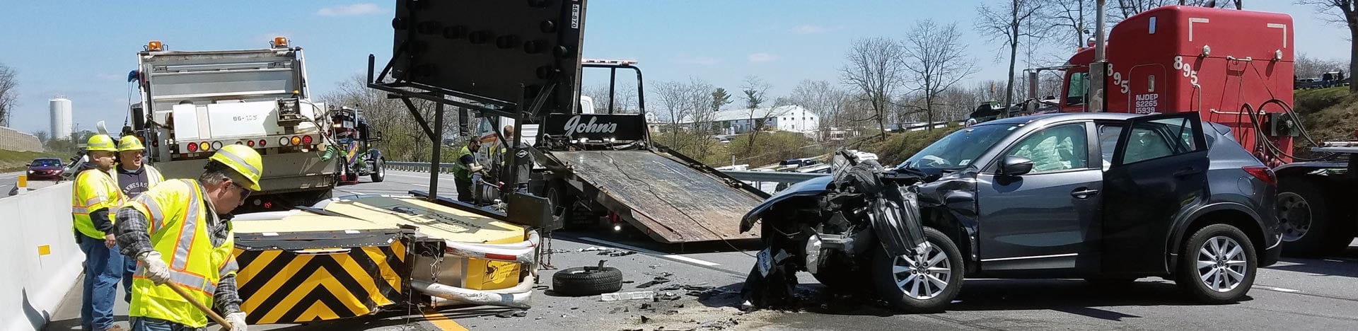 First responders clear a roadway crash scene and restore safe traffic flow.