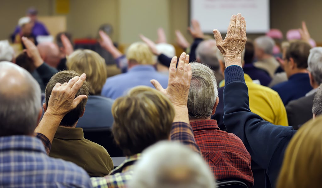Community members gathered at an in-person rail planning listening session.