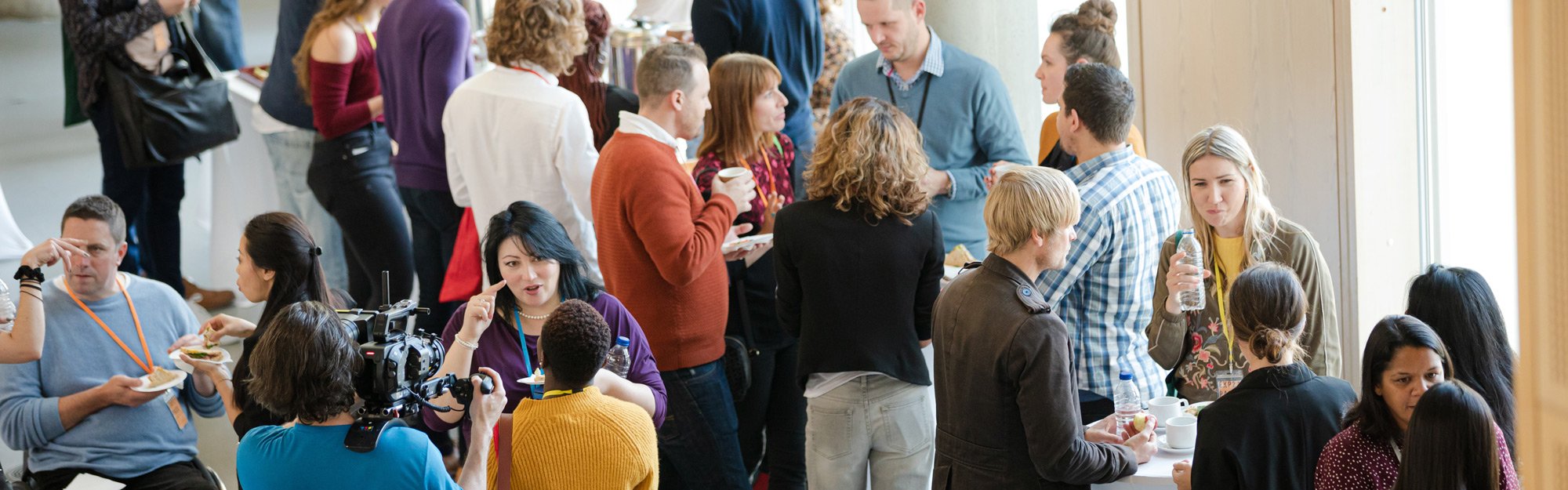 A group of community members in a meeting hall.