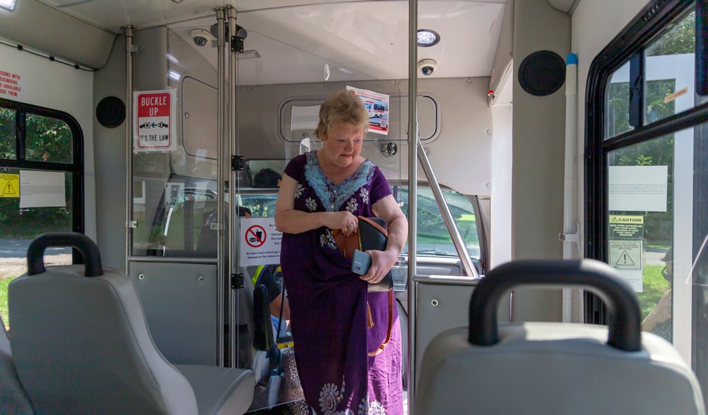 In McDowell County, a rider boards the bus for a doctor’s appointment, one of many important trips made possible through local microtransit service.