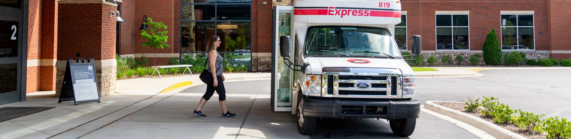 A rider boards the MEE microtransit service, providing on-demand, door-to-door trips within a defined service area.