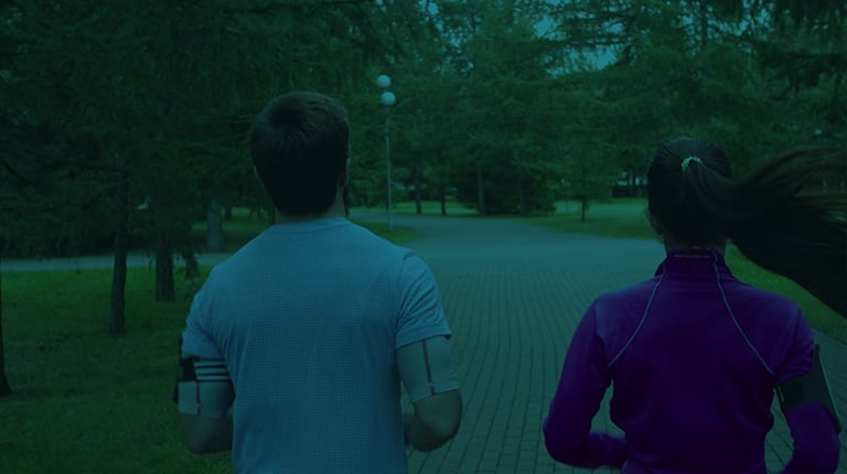 Two people jogging in a park