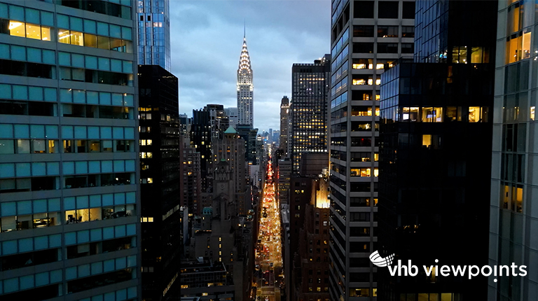 Panning down New York City office buildings at dusk.