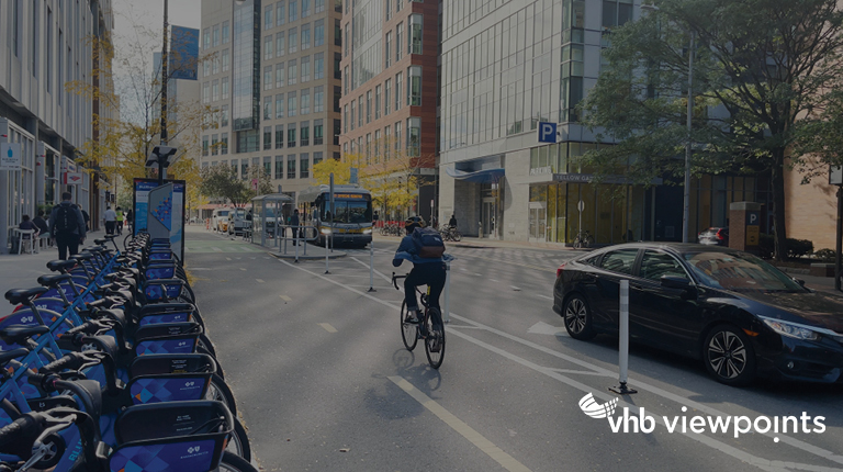 A city street with designated lanes for vehicles and bikes.