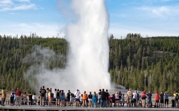 Crowds in front of old faithful in Yellowstone National Park. 