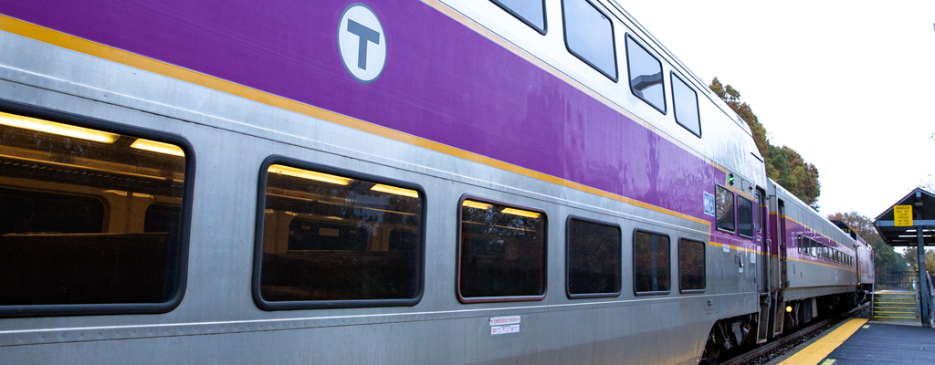 A commuter rail train parked at a station