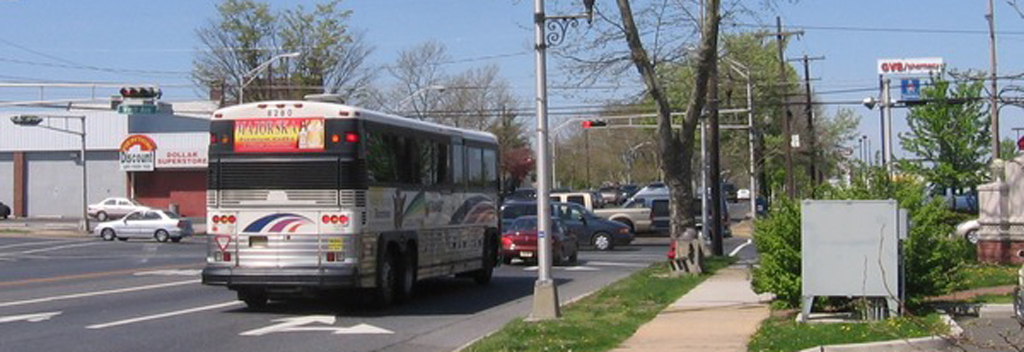 A bus approaching a busy intersection